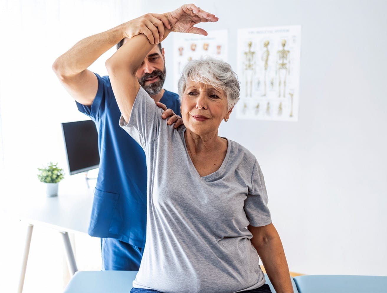 nurse holding a patient's arm up