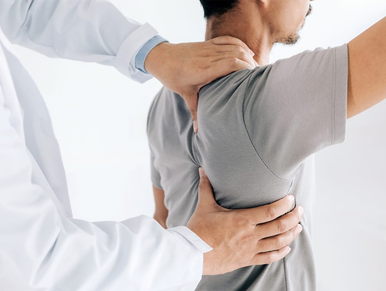 doctor touching a patient's shoulder