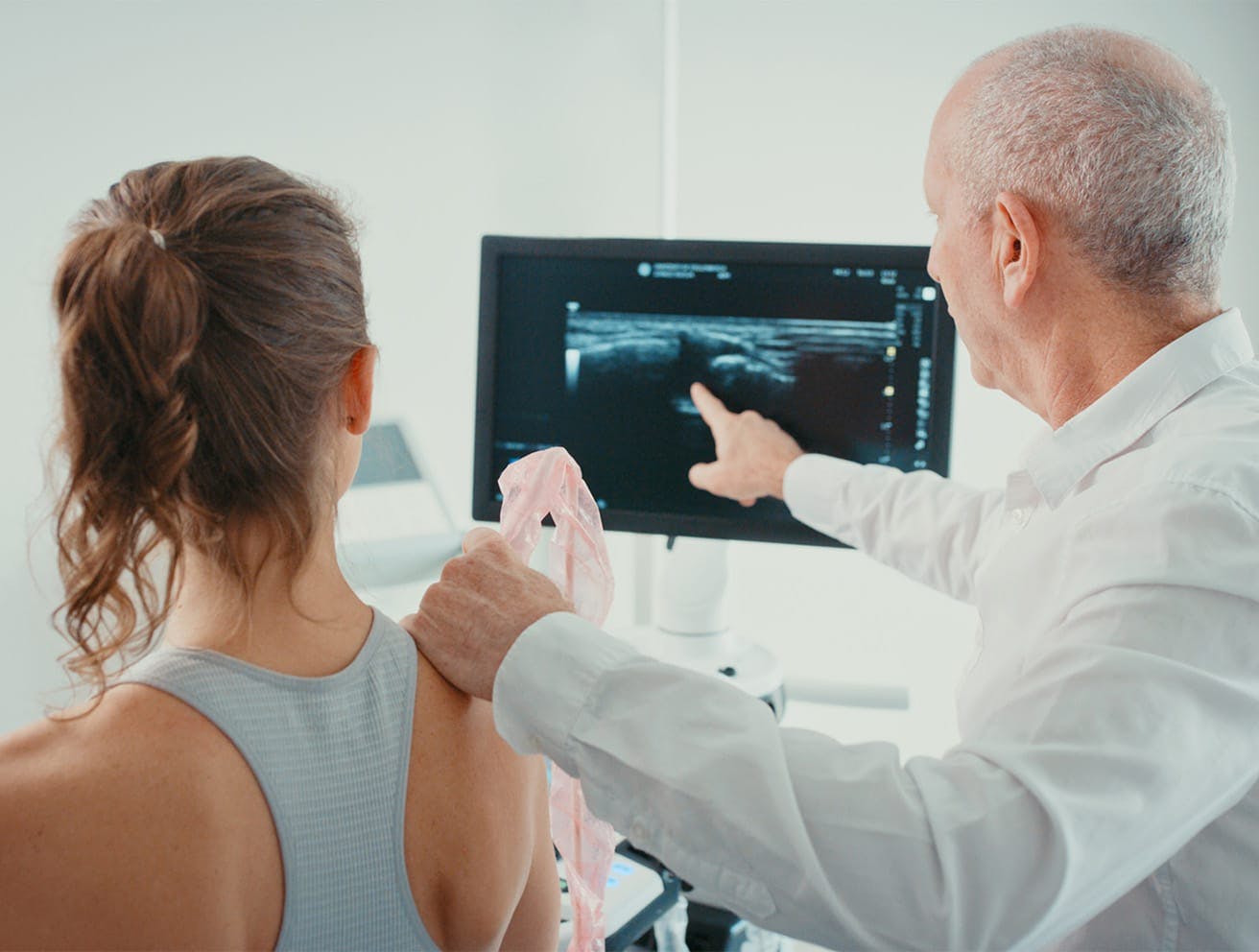 doctor pointing to a monitor
