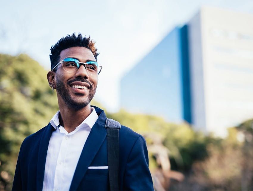 man outside, smiling