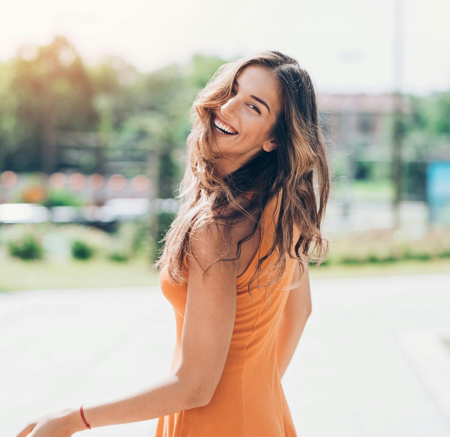 woman looking back, smiling