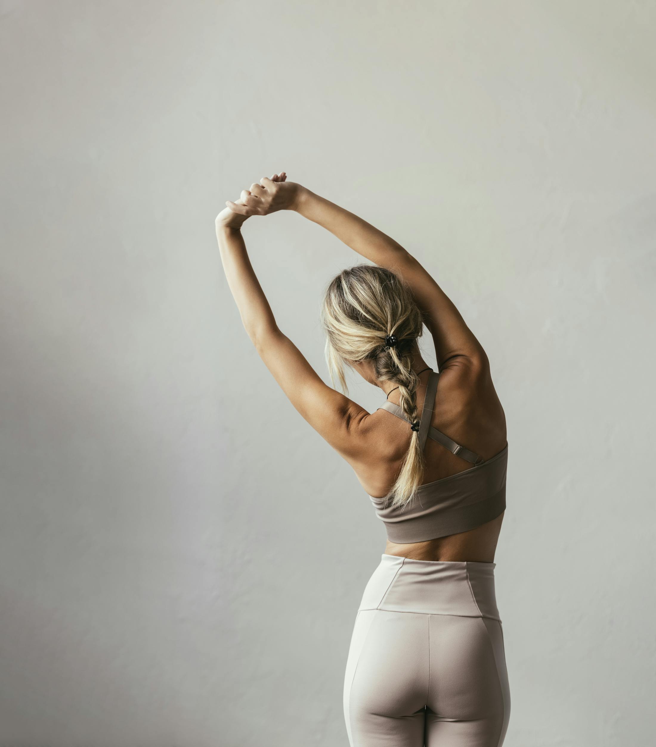 image from the back of a Woman exercising