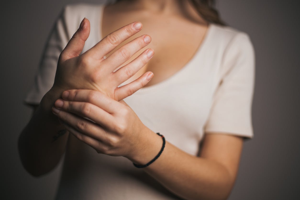 woman holding her wrist