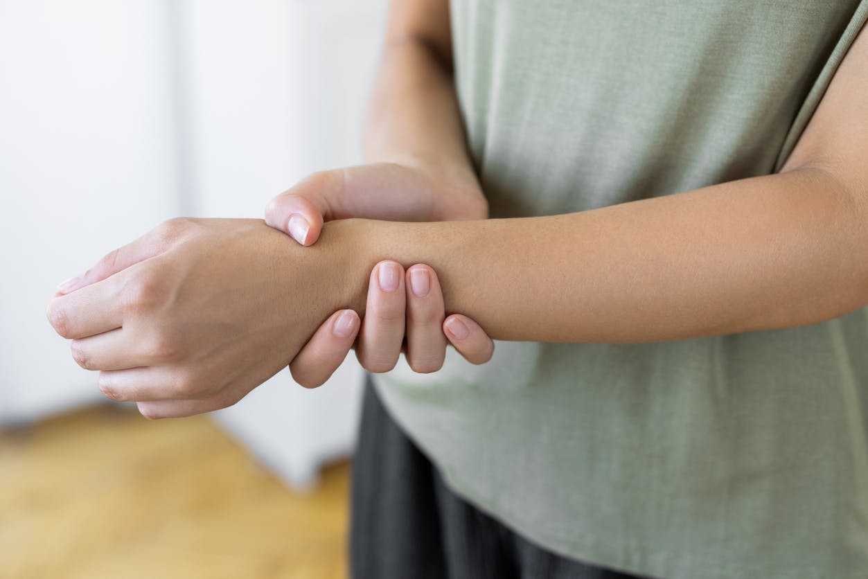 person holding their wrist