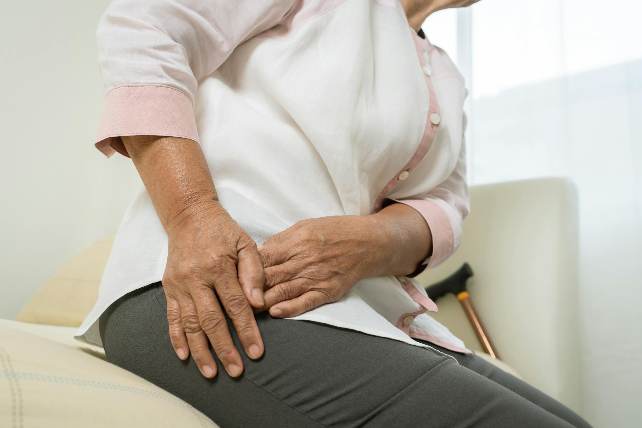woman holding her side