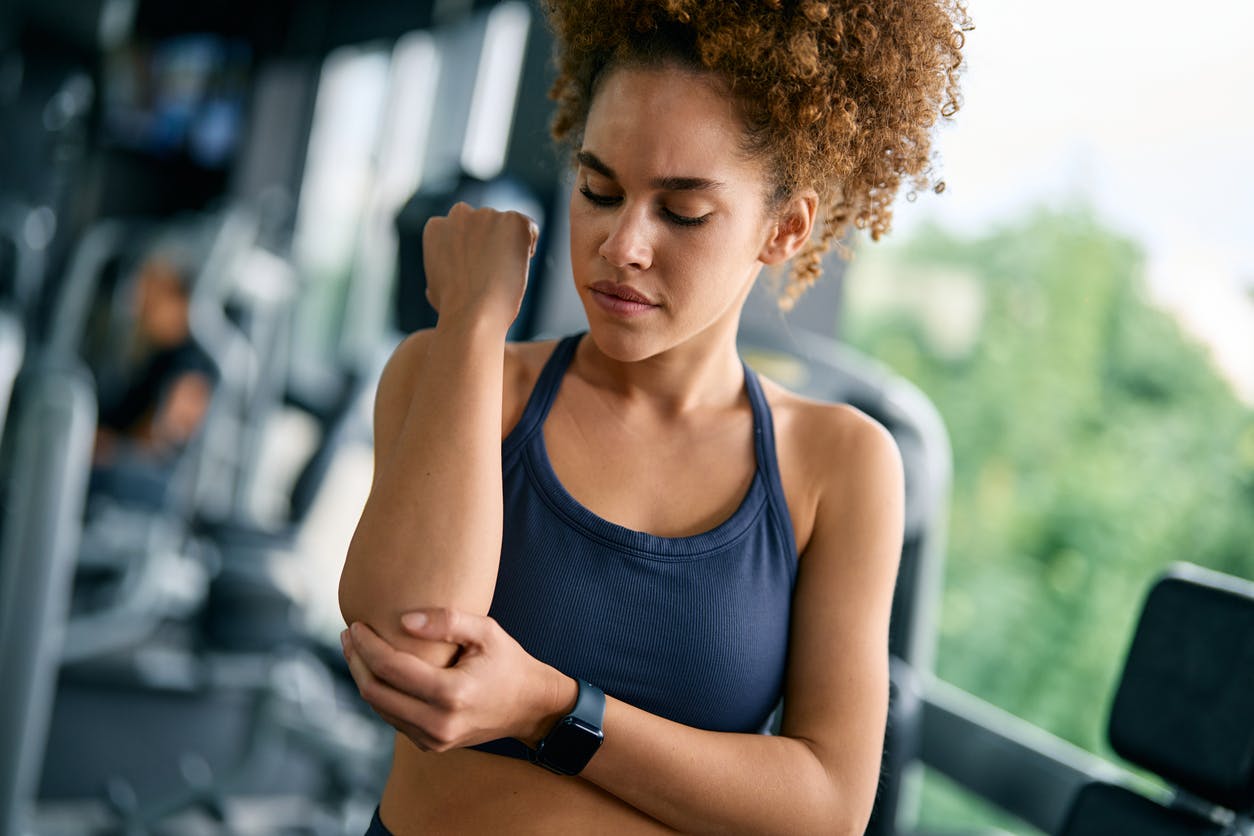 woman in holding her elbow