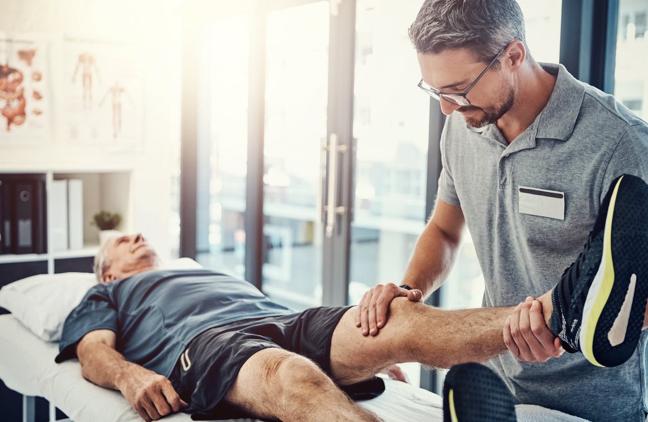 man receiving physical therapy