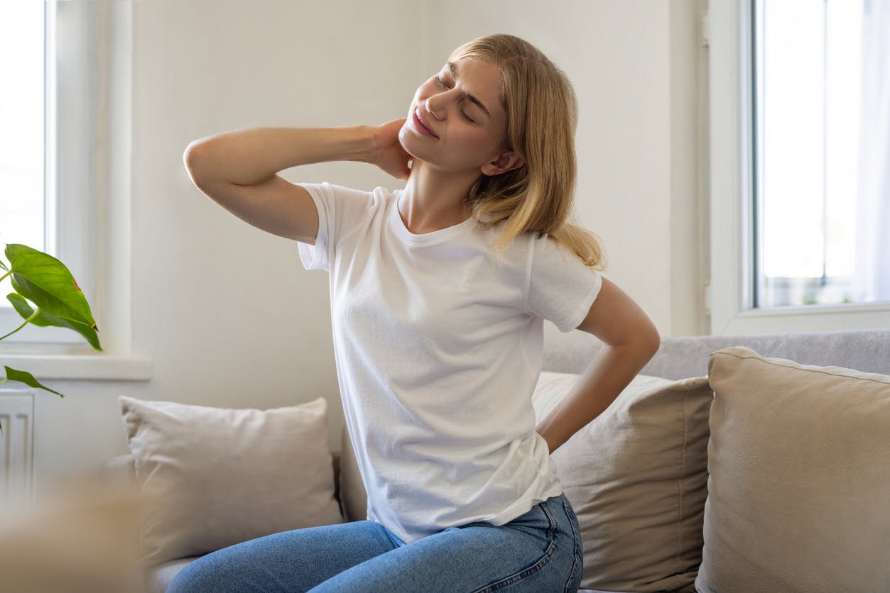 woman stretching her neck and back