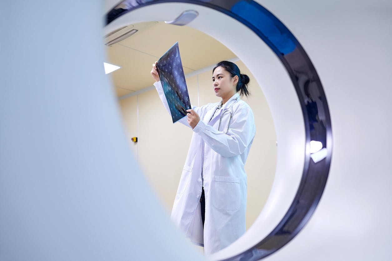 woman looking at MRI results