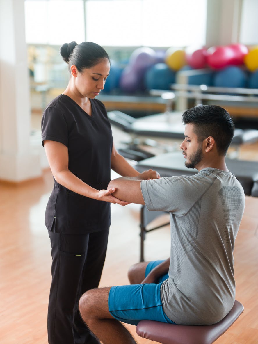 physical therapist and patient