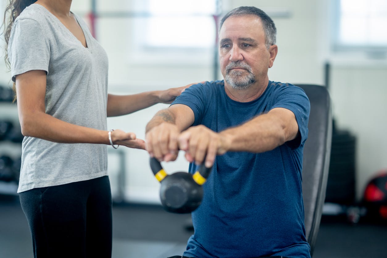 man holding dumbbell