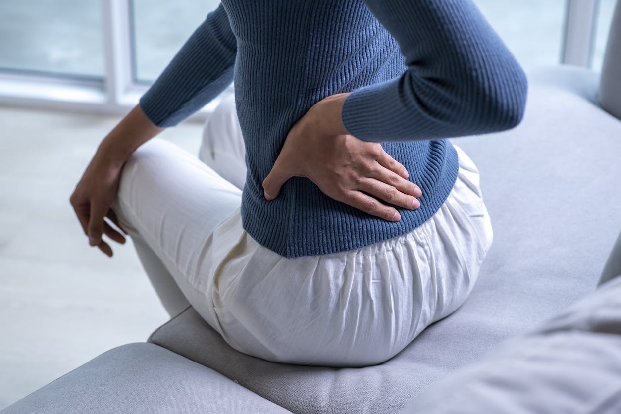 woman holding her hip