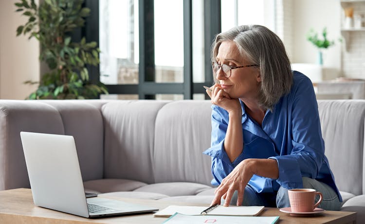 older woman looking at laptop