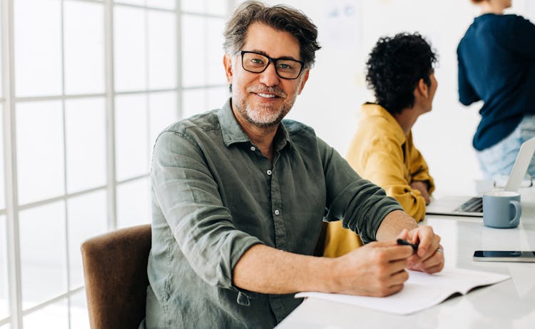 man smiling during meeting