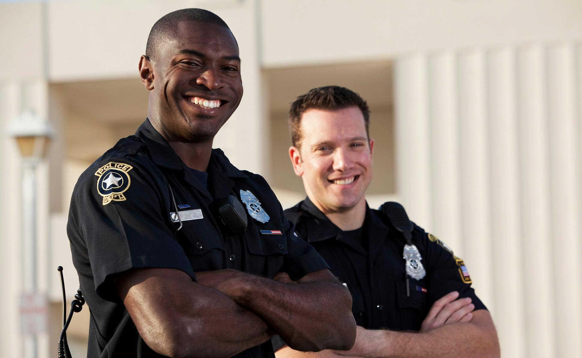 2 police men smiling
