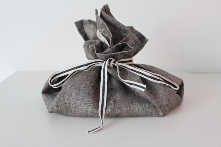 Image of a tea-towel wrapped gift.