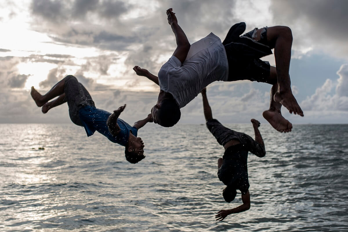 image of kids jumping into water