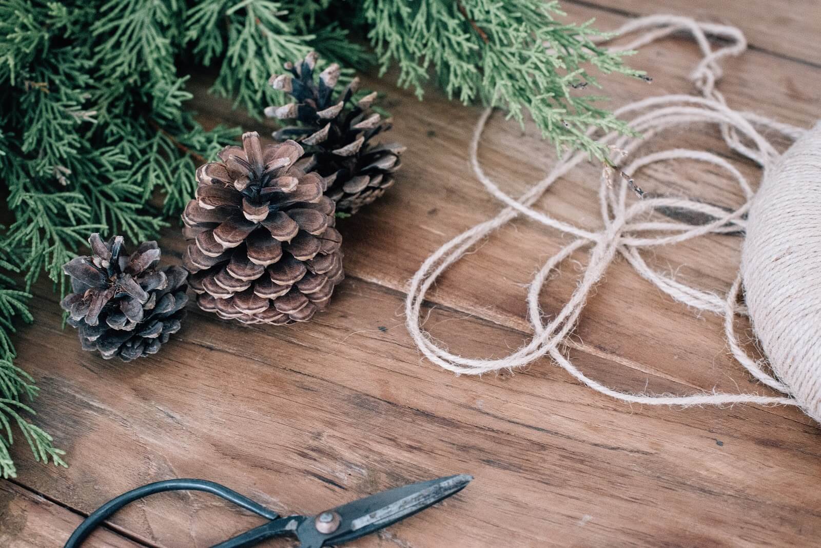Natural or recycled wreaths, driftwood ornaments, decorated pine cones, and snowflakes made out of sticks.