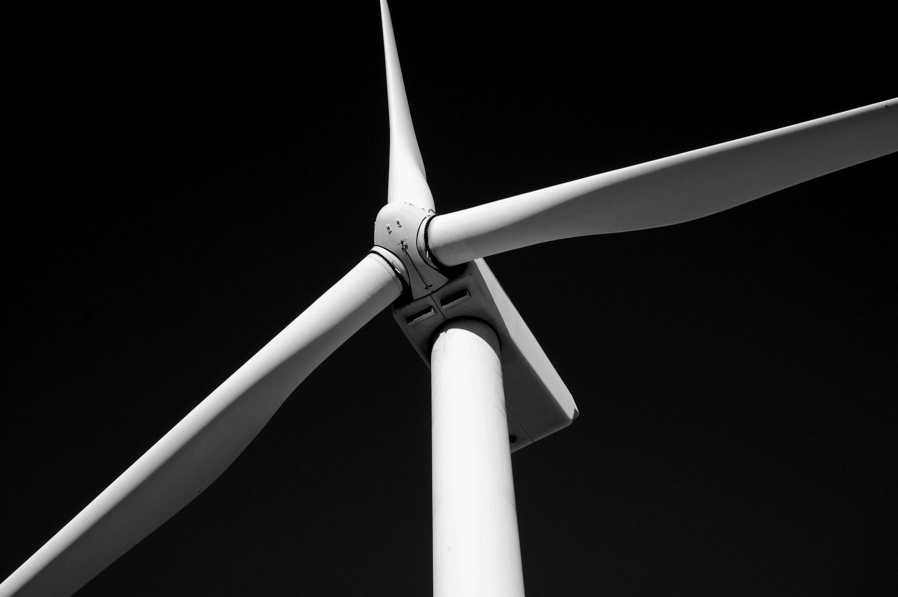 black and white close up image of the top of a wind turbine