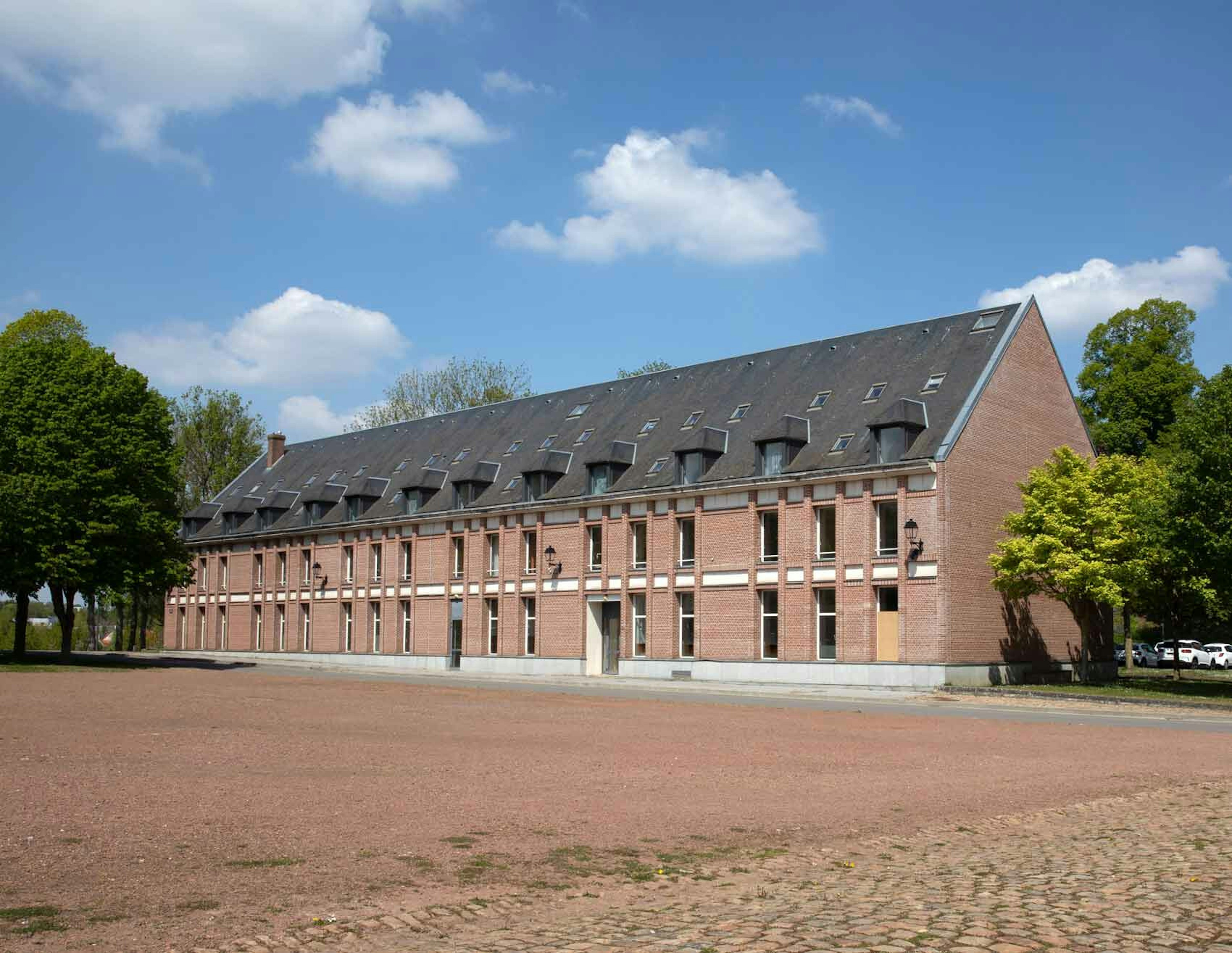 architecture, building, housing, campus, monastery, house, car, vehicle, grass, outdoors