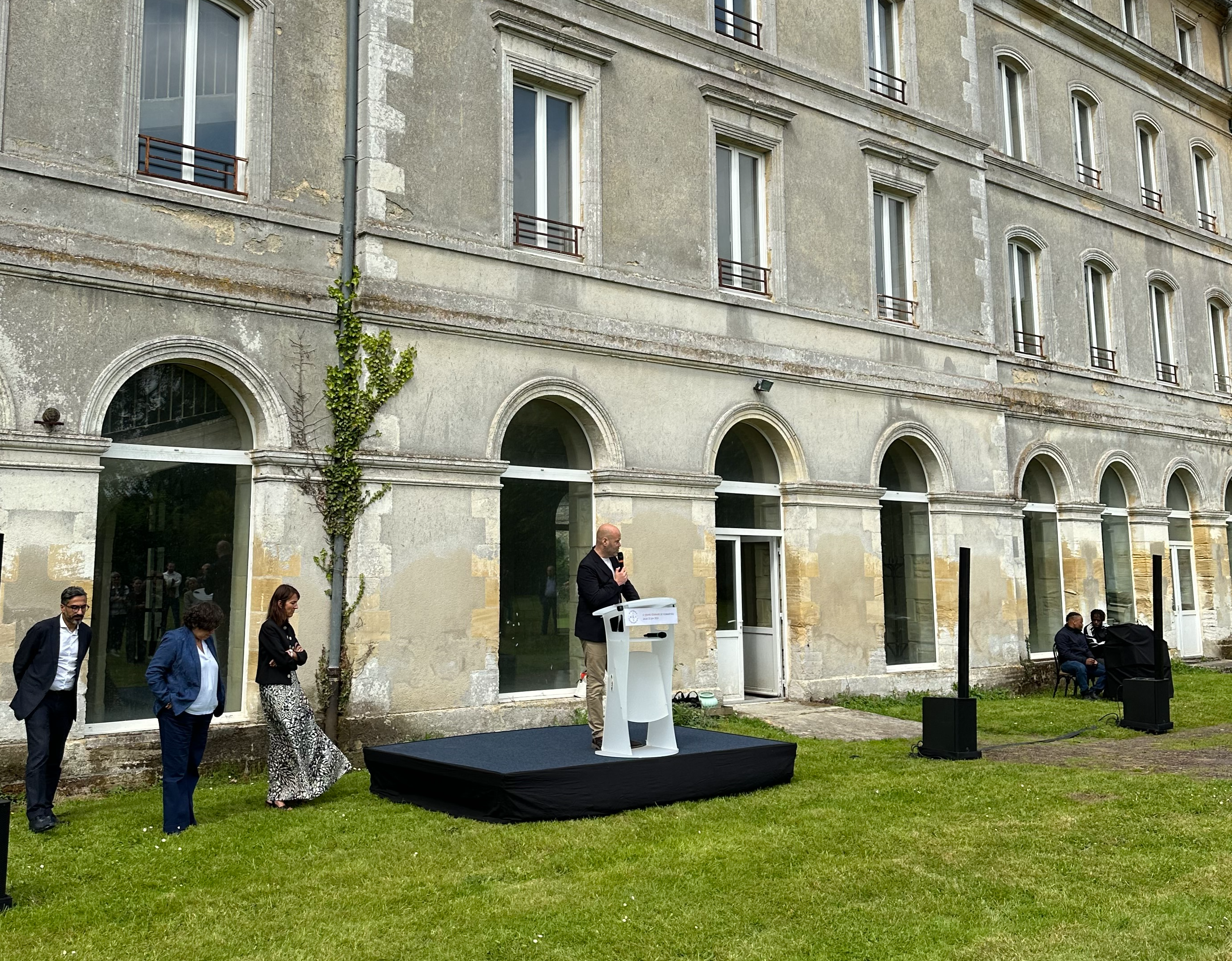person, grass, plant, footwear, shoe, monastery, speaker, lamp, college, campus