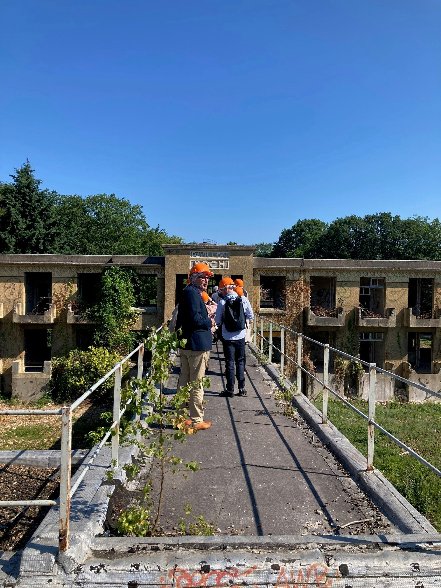 helmet, person, adult, male, man, walkway, shoe, outdoors, bag, nature