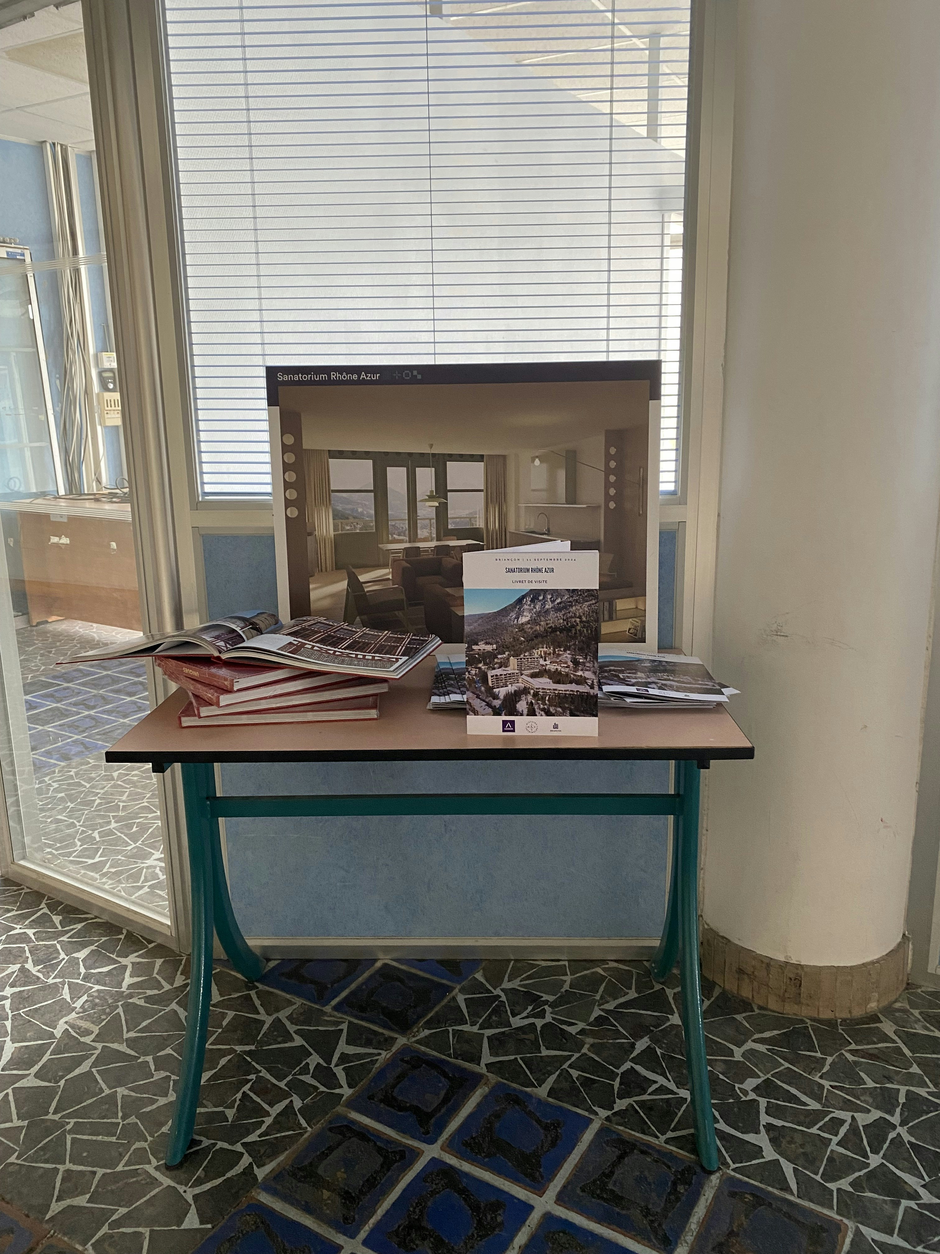 furniture, table, floor, desk, flooring, chair, indoors, interior design, book, publication