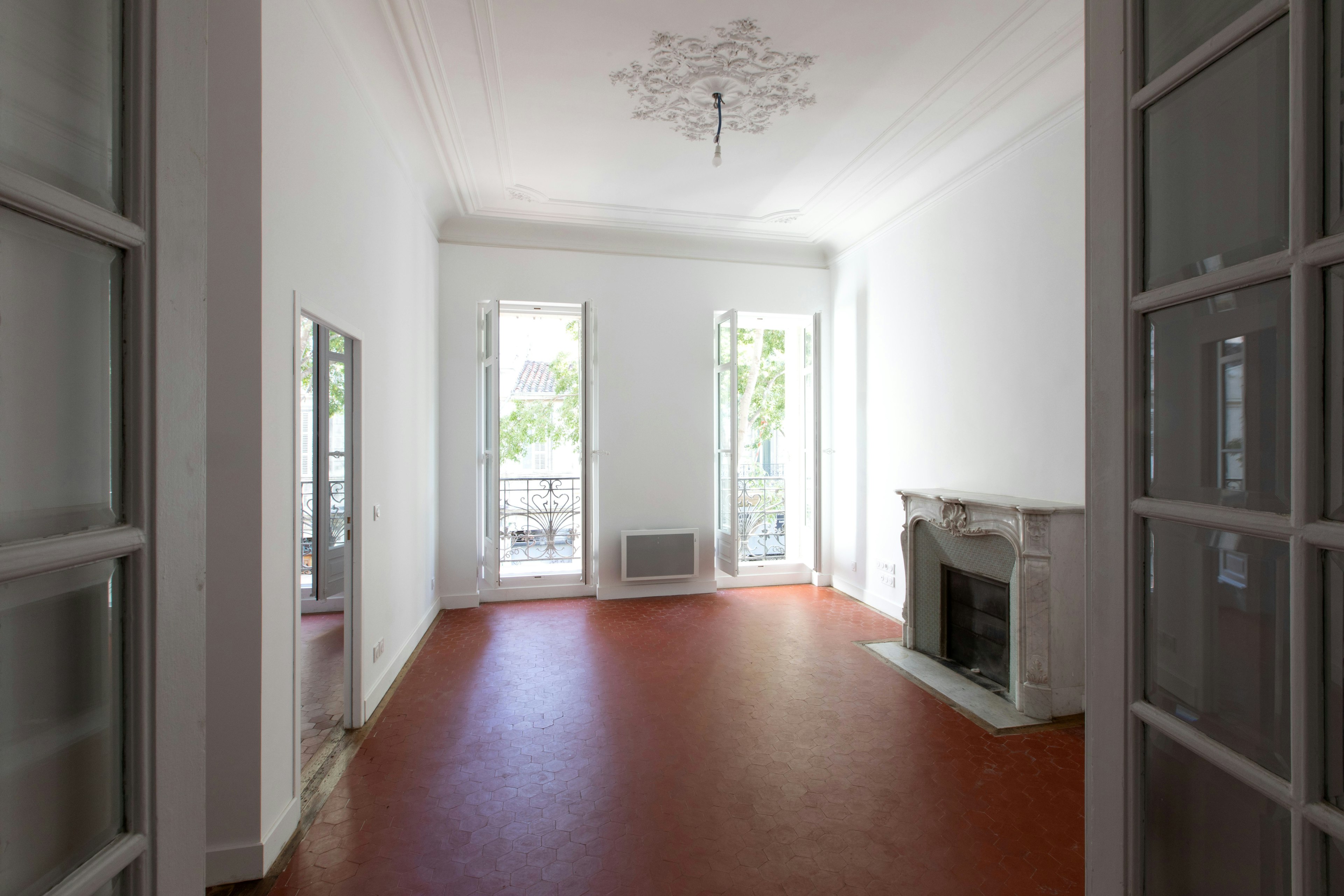 floor, flooring, chandelier, lamp, indoors, interior design, living room, room, door, fireplace