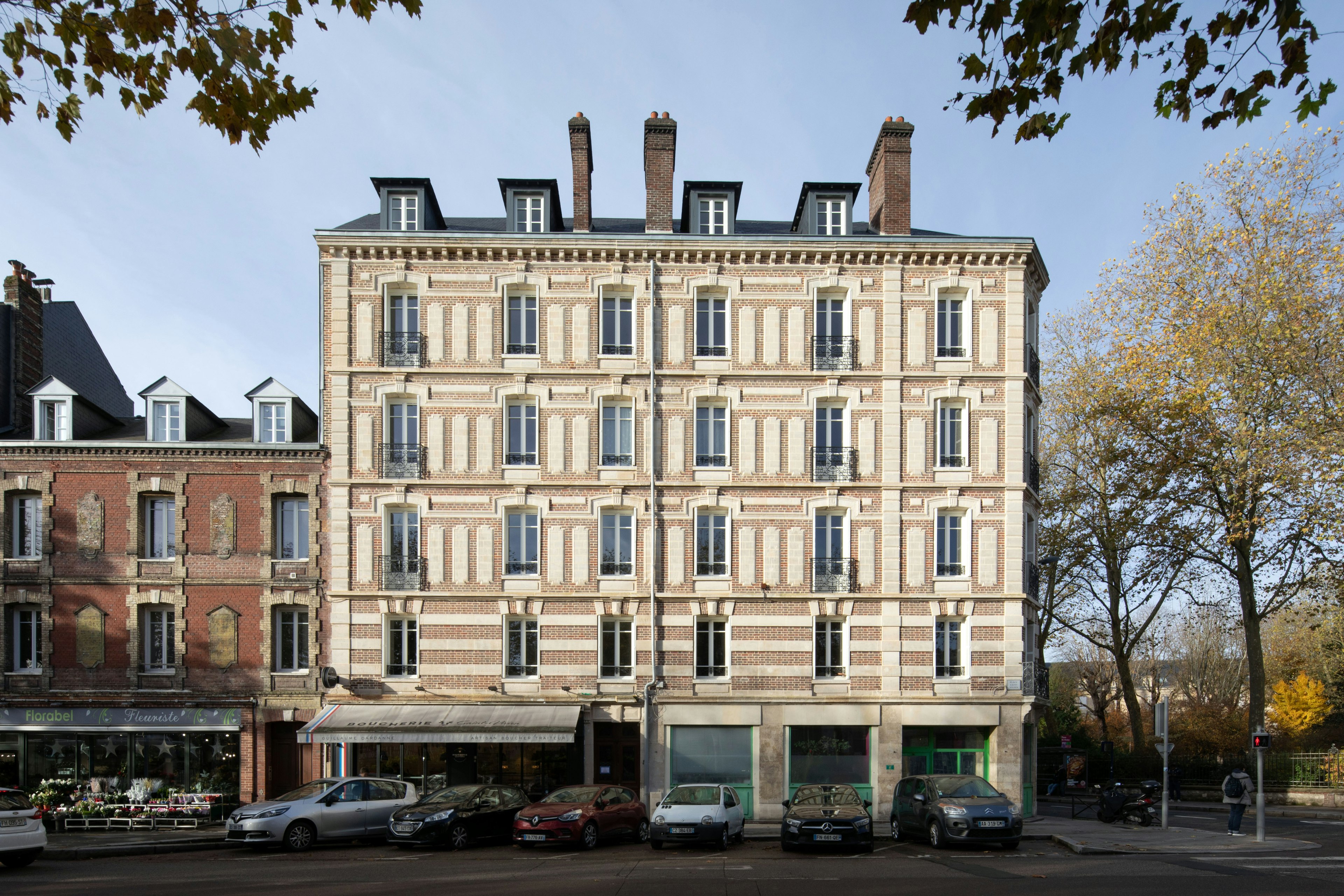 city, urban, high rise, road, street, condo, apartment building, office building, car, person