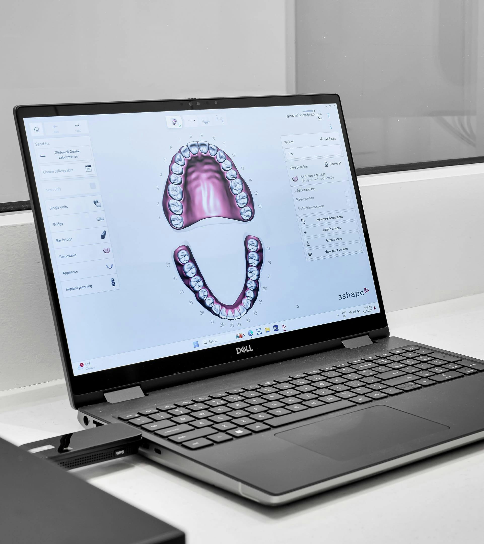 laptop with an image of teeth on it