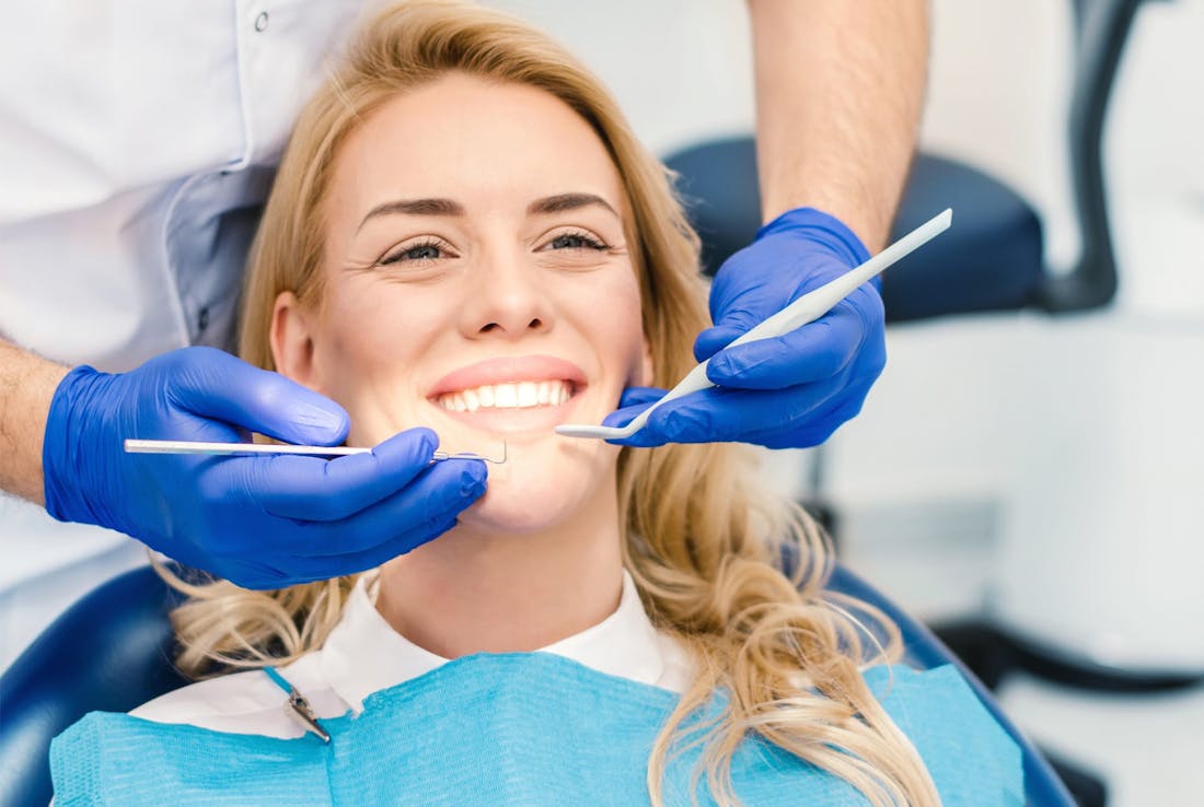woman getting her teeth checked
