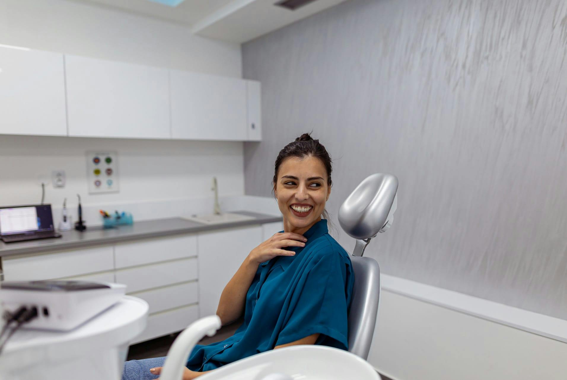 woman in a chair smiling