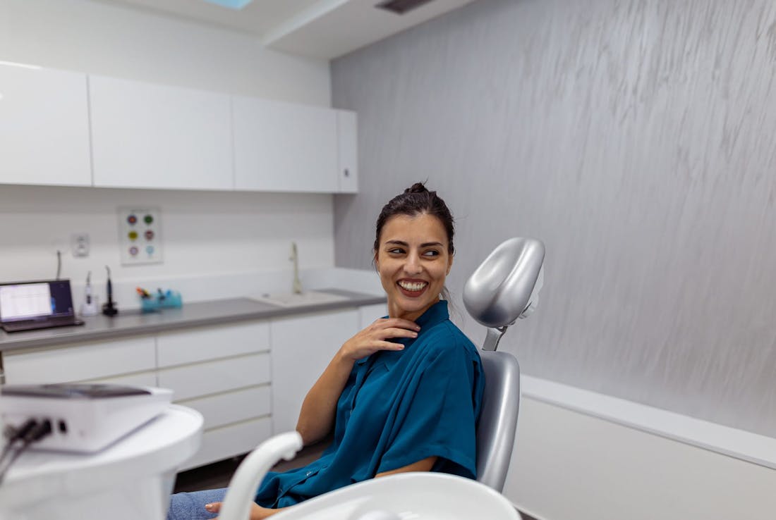 woman in a chair smiling