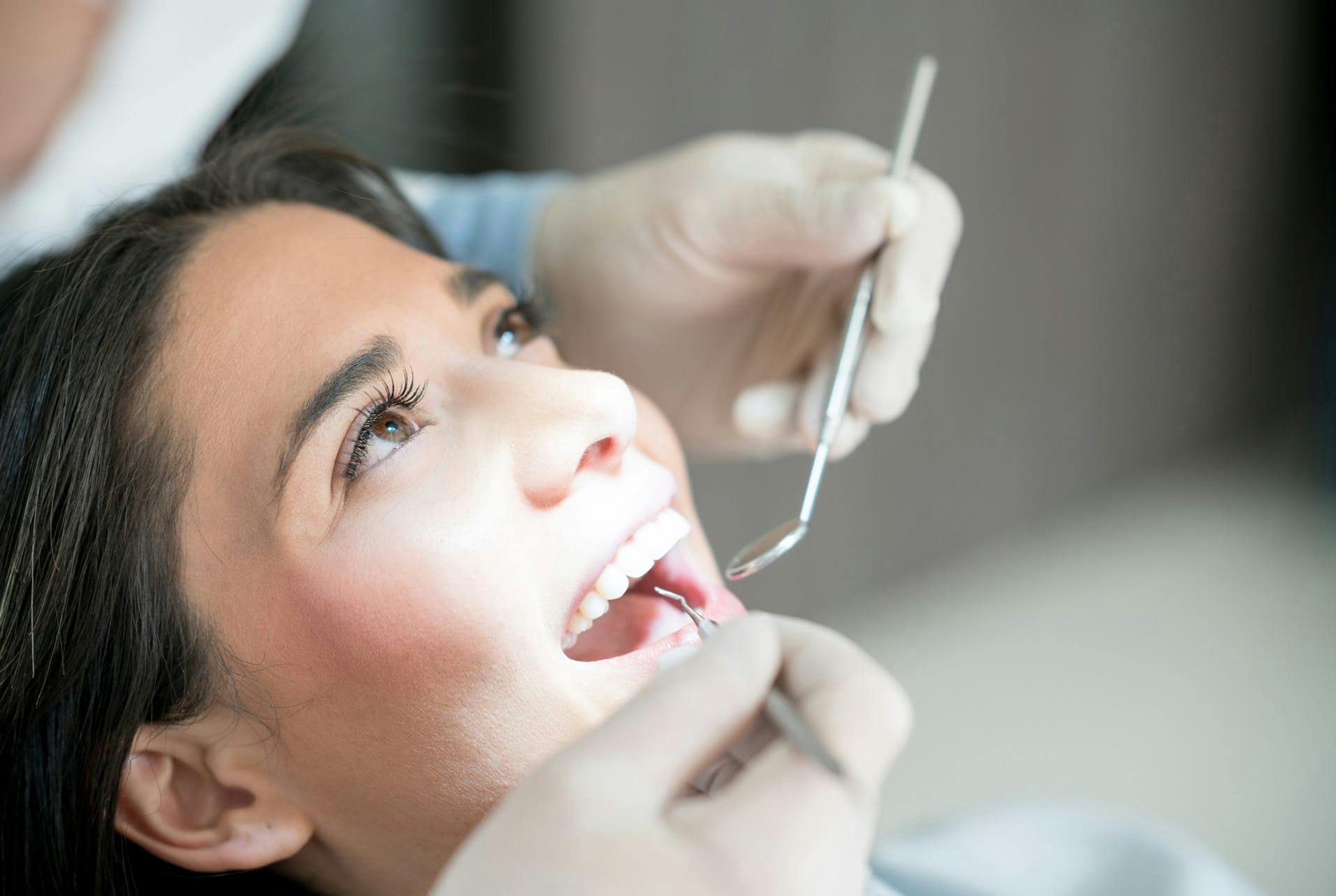 woman getting her teeth checked