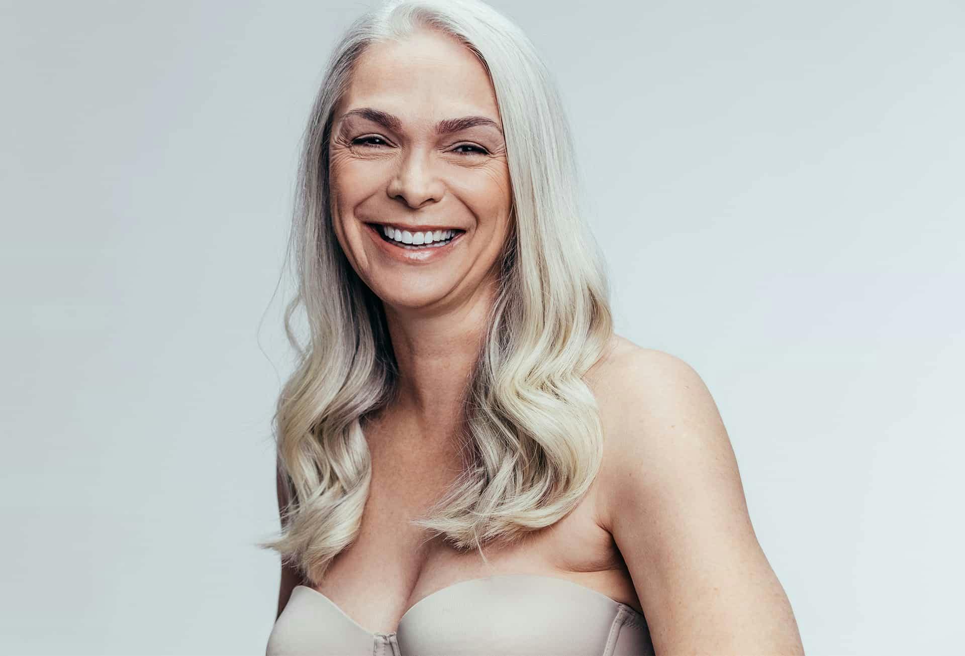 Older woman smiling into camera