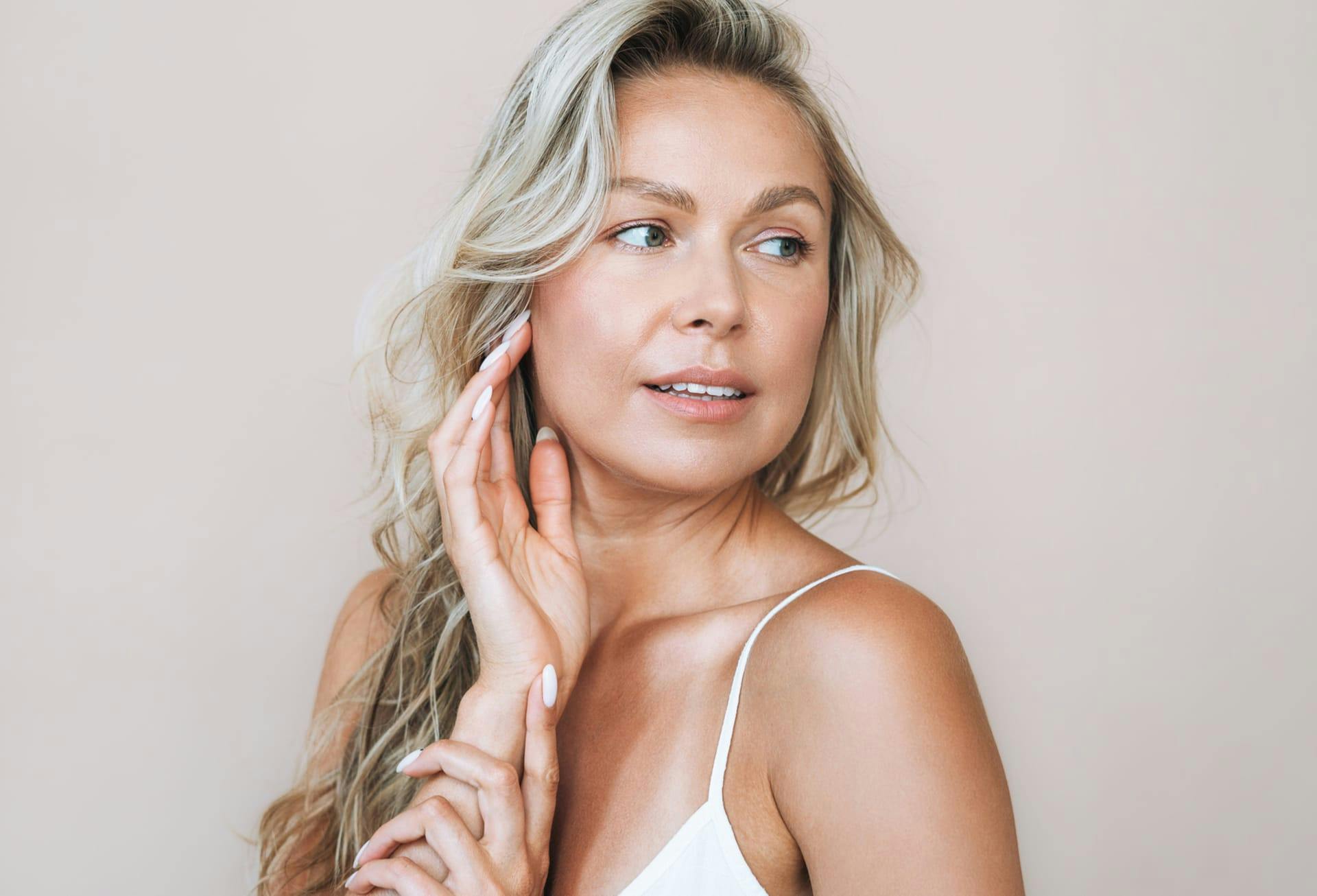 Woman with her hand on her face