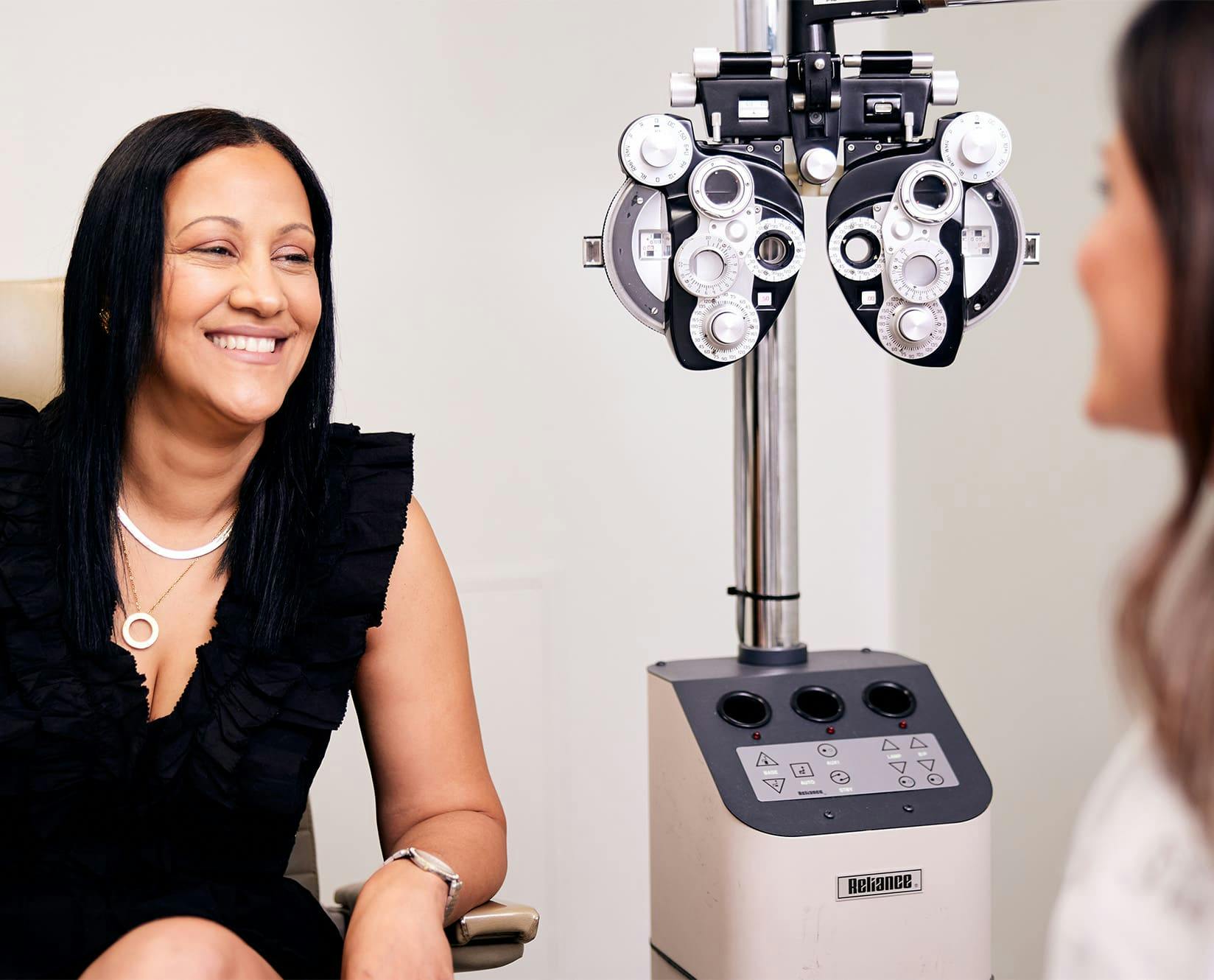 patient and staff speaking at Dello Russo Laser Vision