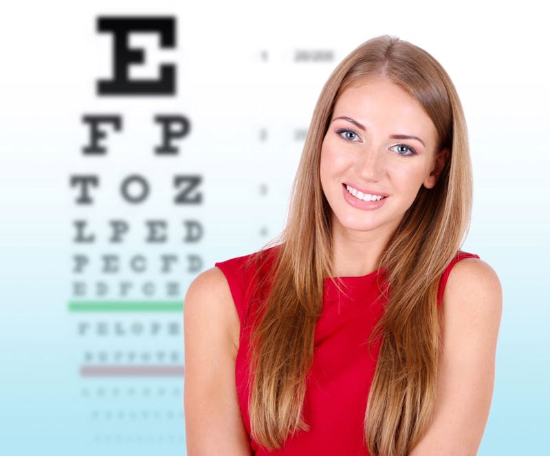 woman in front of letters for an eye exam