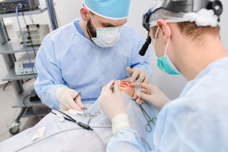 eye surgeons performing surgery on a patient
