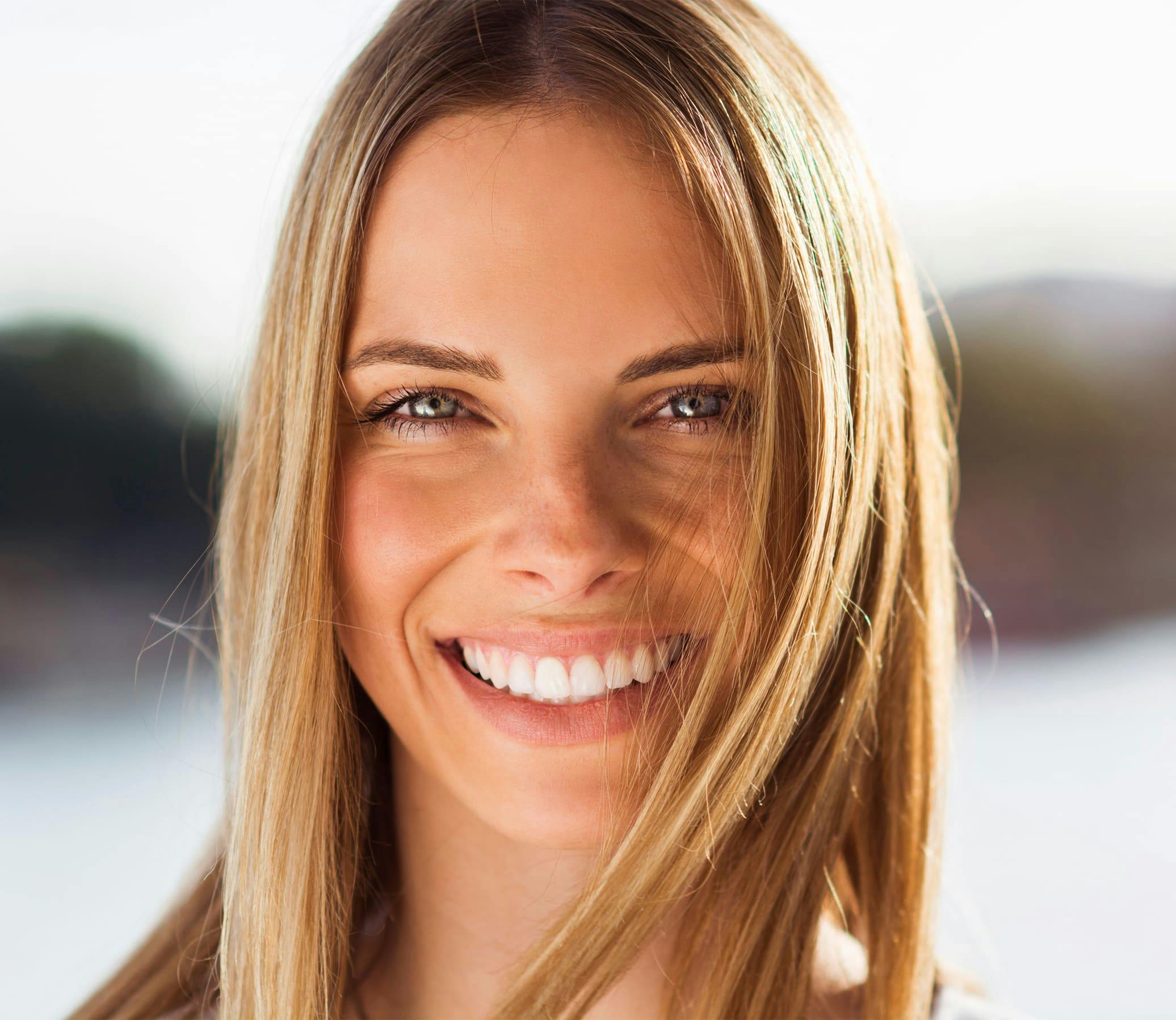 woman with blonde hair smiling