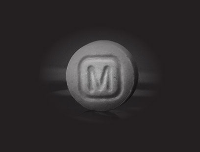 A pill with the letter M on it.