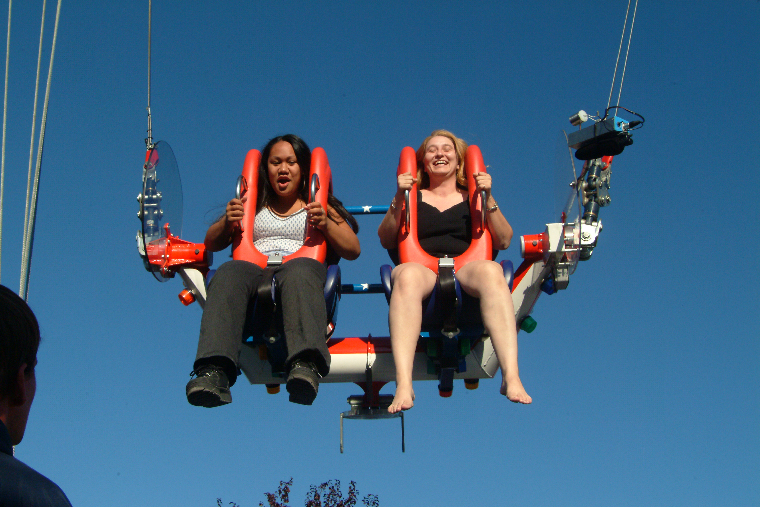 Two girls on Sling Shot Ride in Adventure Zone