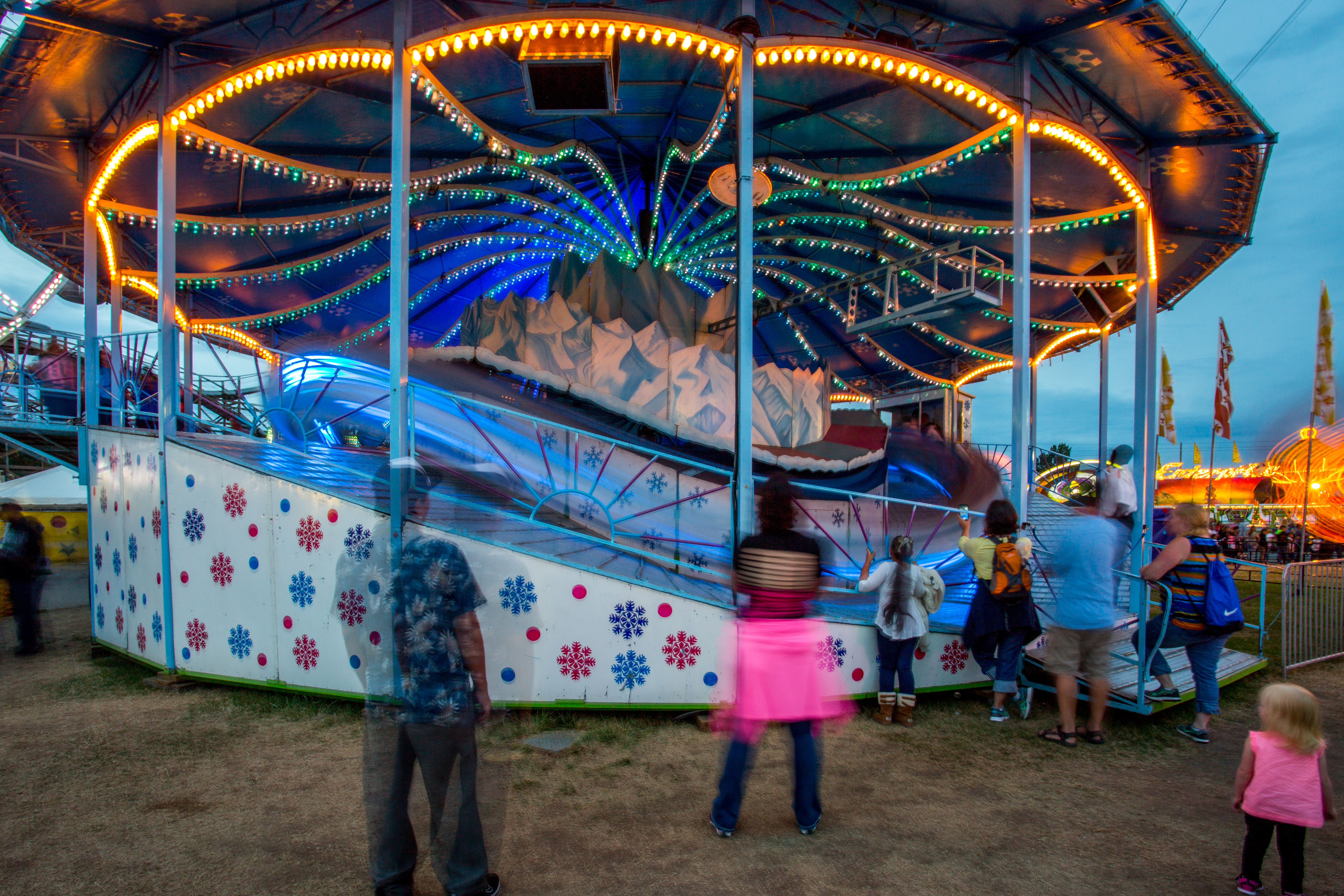 A long-exposure photograph of The Matterhorn, a spinning coaster-style ride with a mountain theme.