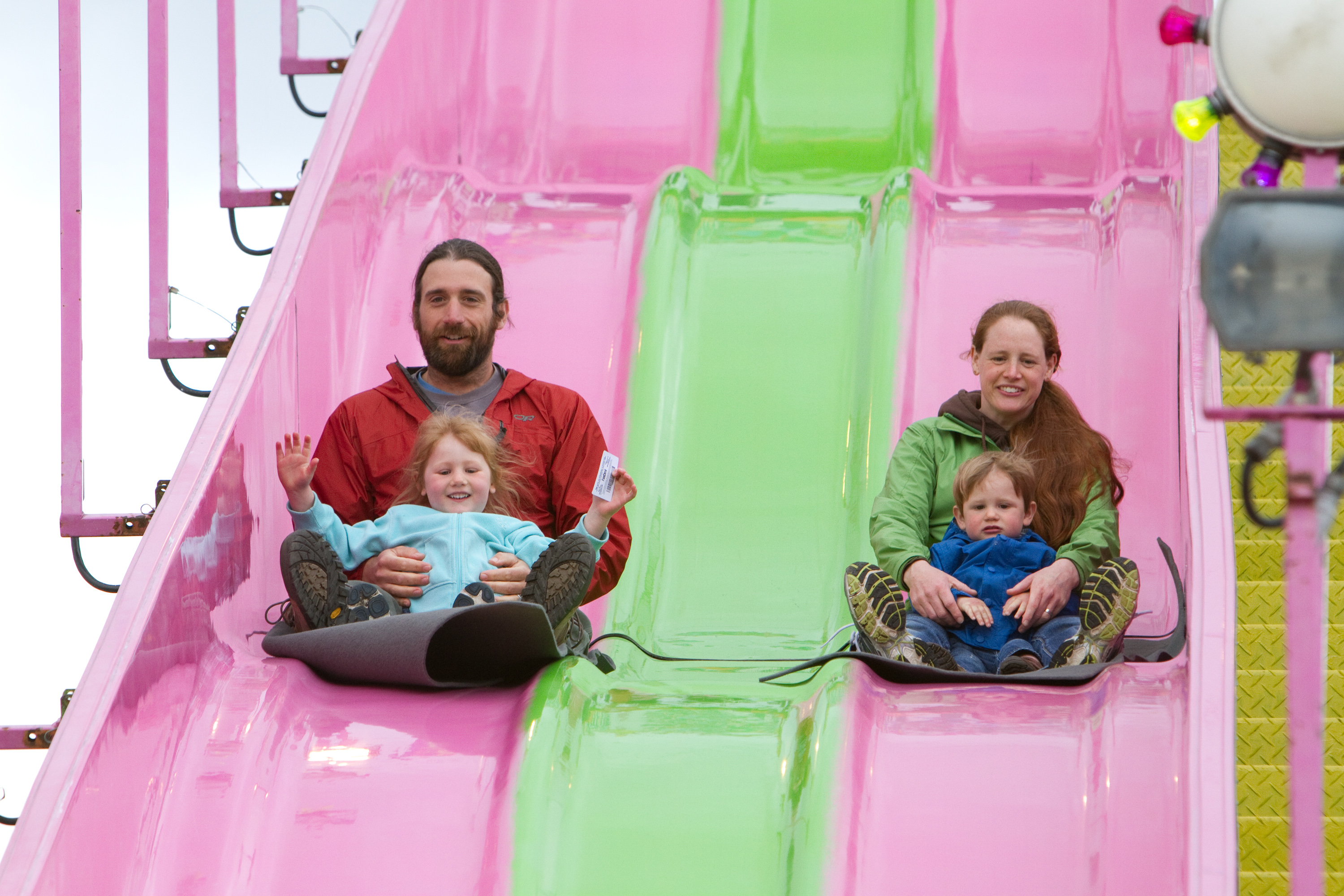 family on kiddy slide