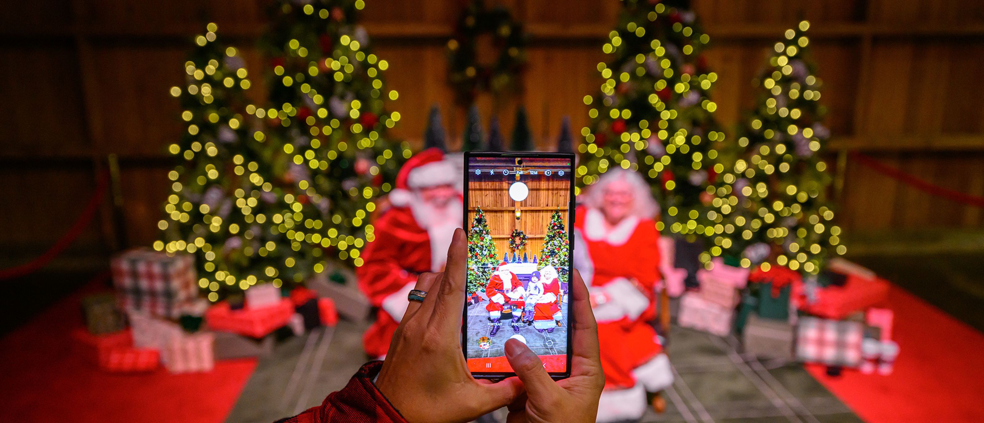 Photo being taken with Santa & Mrs. Claus