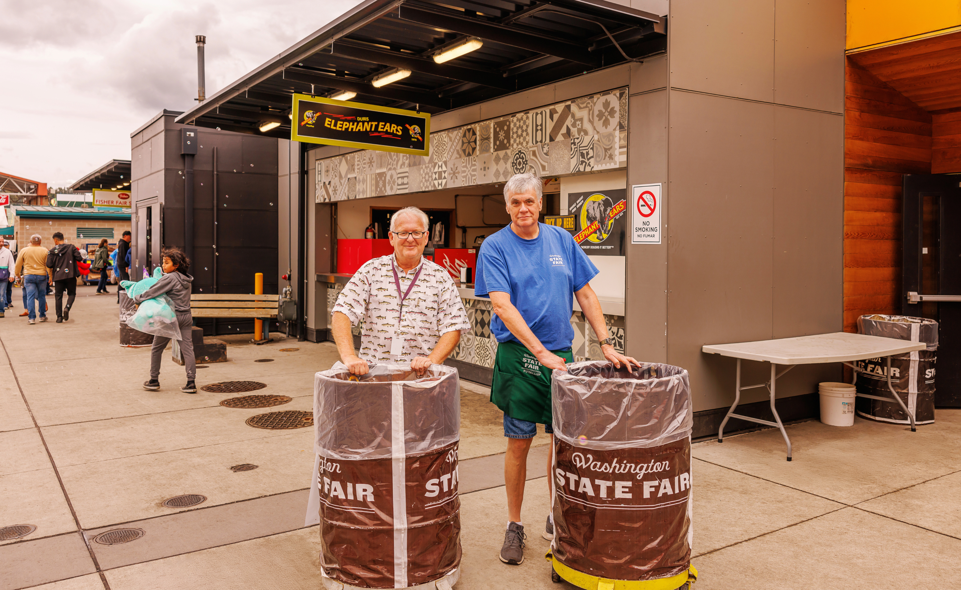 Two men working at the Washington State Fair