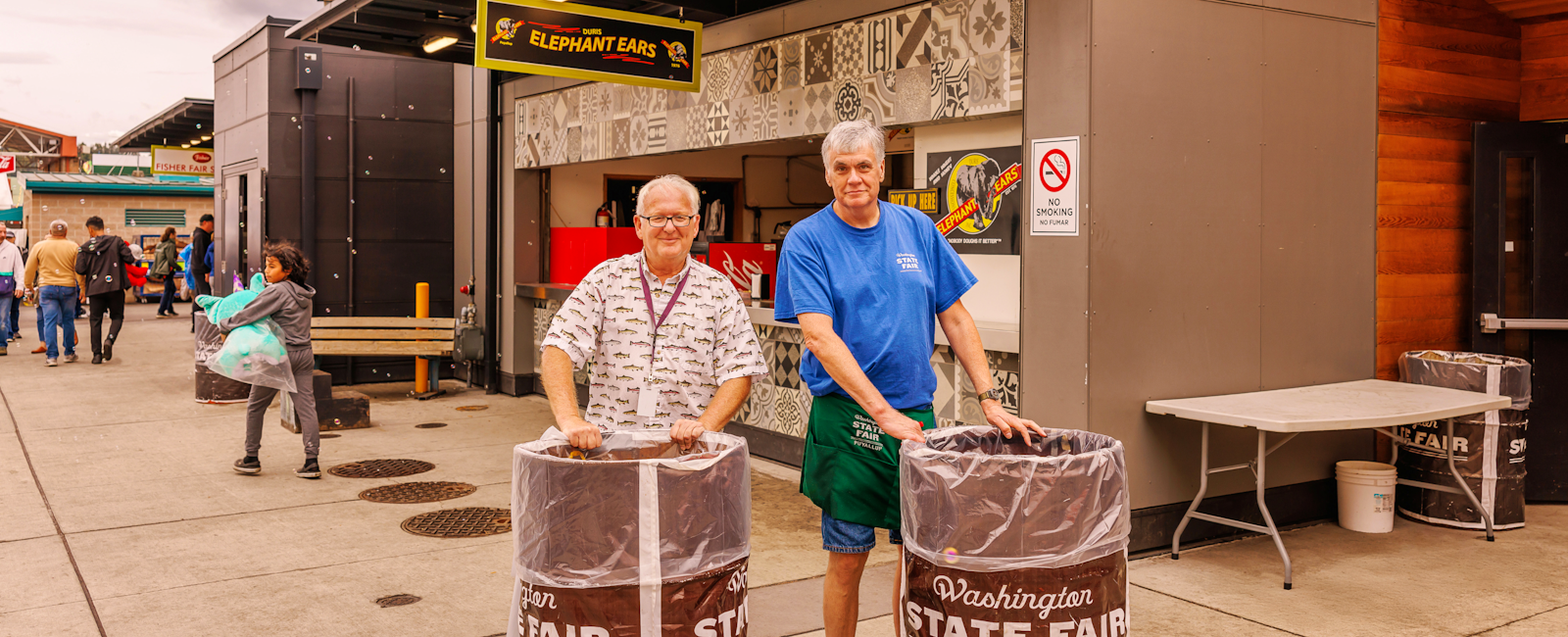 Two men working at the Washington State Fair
