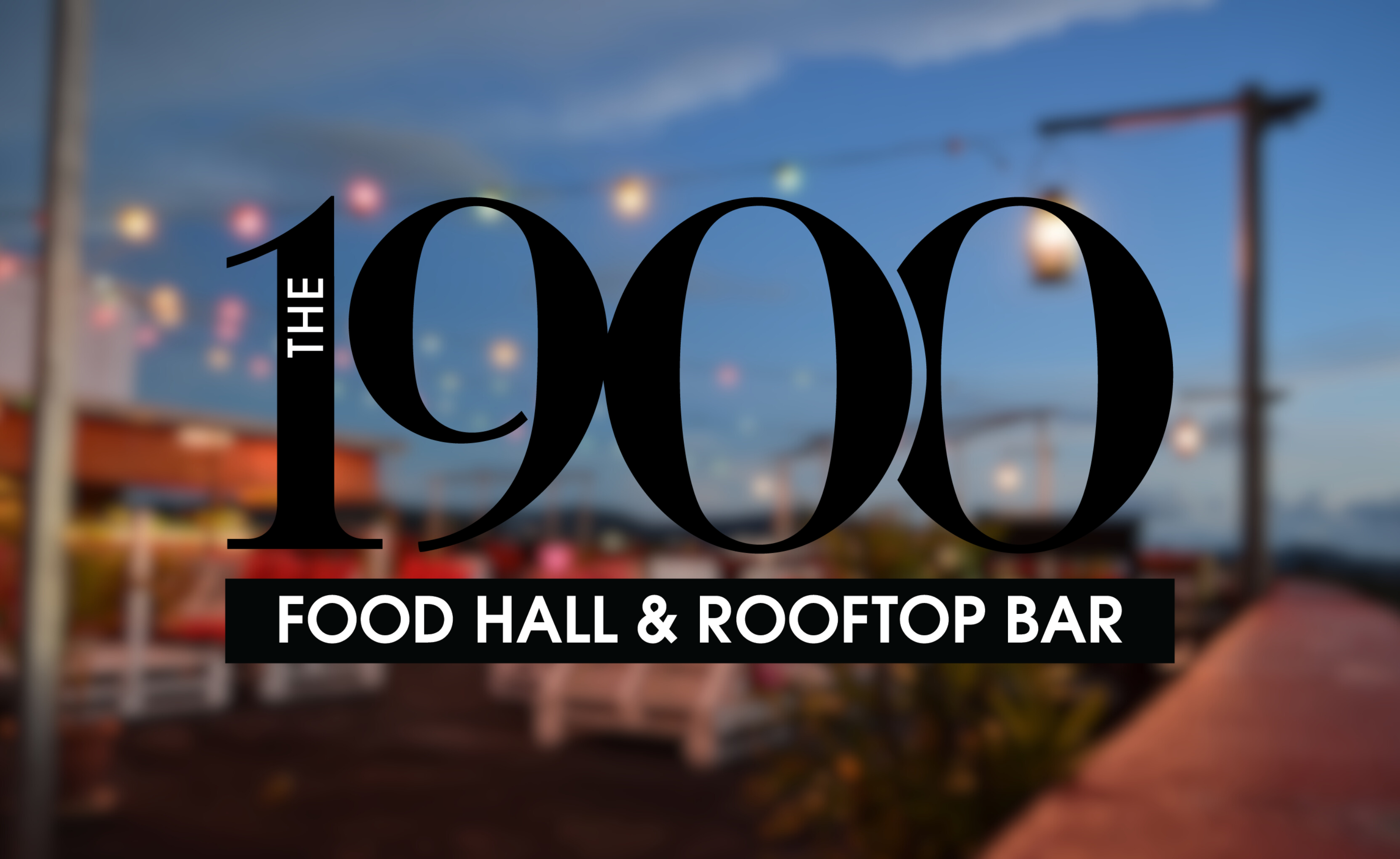 Blurred image of a rooftop bar with the words The 1900 Food Hall & Rooftop Bar over top