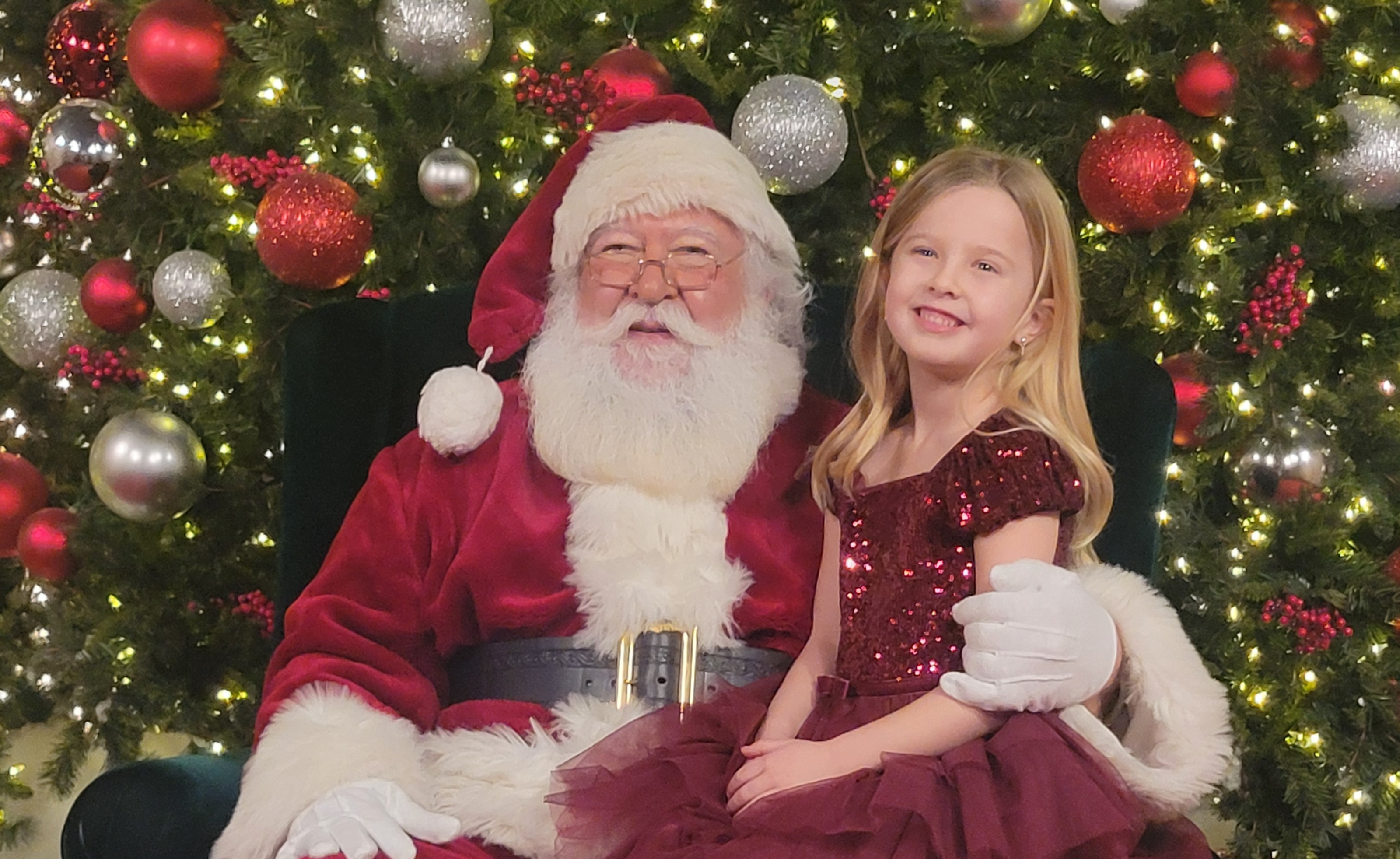 Girl sitting on Santa's Lap