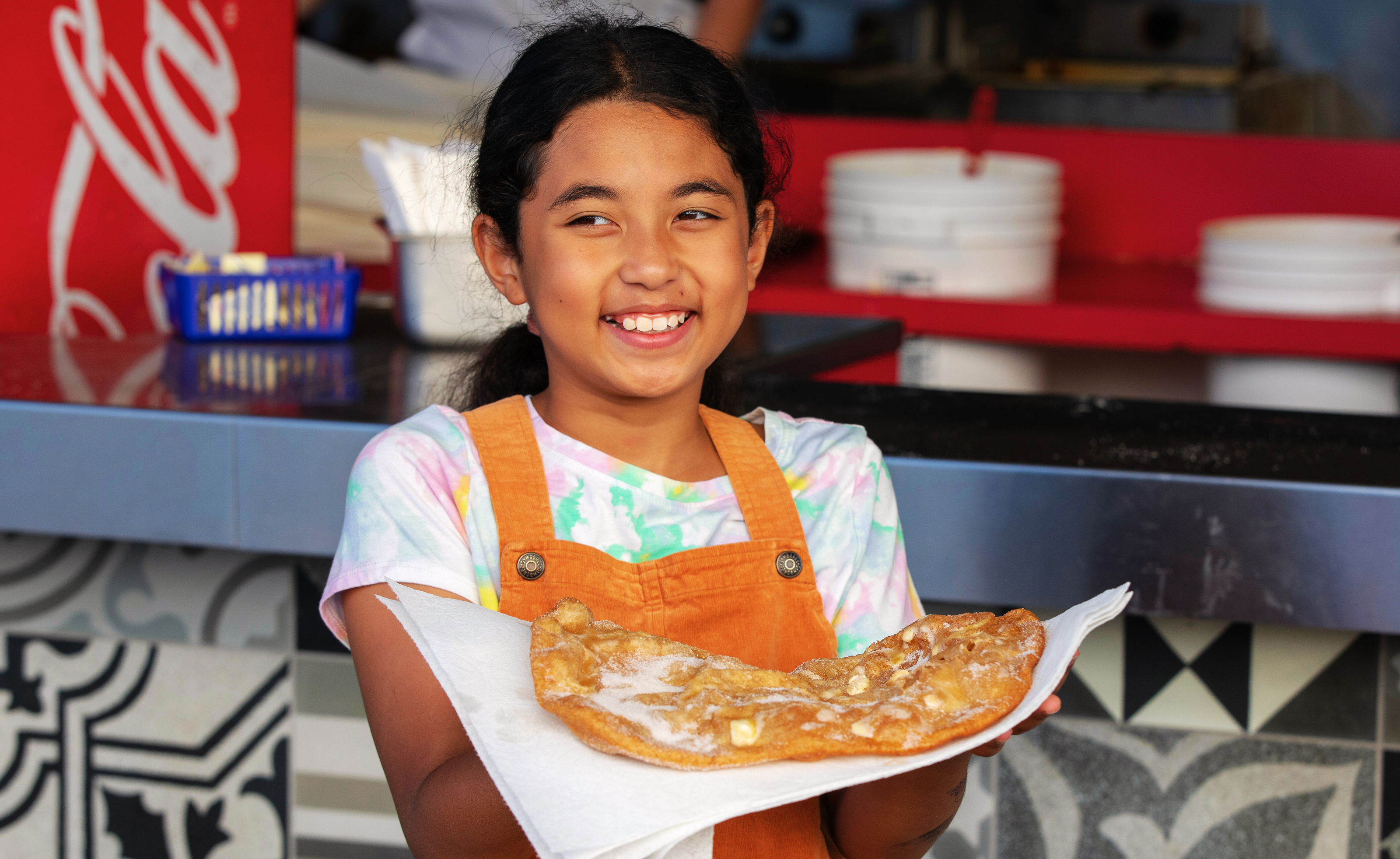 Girl holding an elephant ear